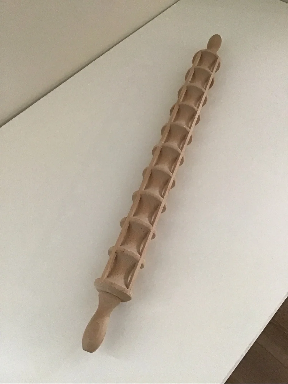 Traditional wooden ravioli rolling pin